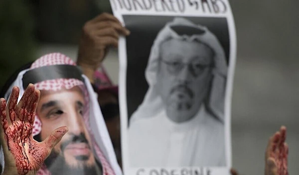 A demonstrator dressed as MBS with blood on his hands protests outside the Saudi Embassy in Washington, DC, demanding justice Khashoggi. (AFP)