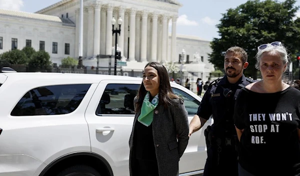 Democratic Congresswoman Alexandria Ocasio-Cortez of New York detained by US Capitol Police Officers on  in Washington, DC, July 19, 2022 (AFP)