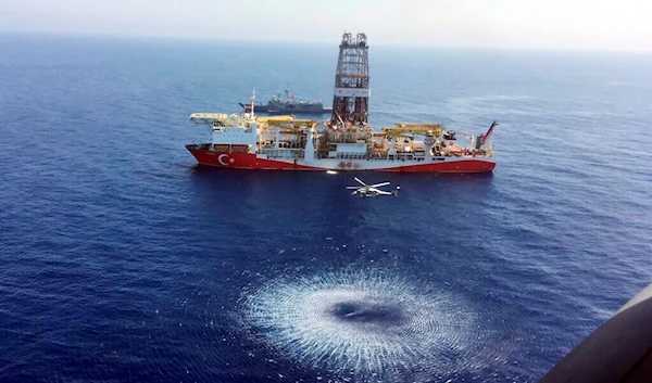 A helicopter flies over Turkey's drilling ship, 'Fatih' dispatched towards the eastern Mediterranean, near Cyprus, on July 9, 2019 (AP)