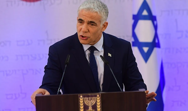 Israeli occupation Prime Minister Yair Lapid in "Tel Aviv" on April 14, 2022