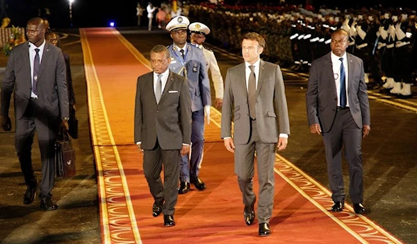 French President Emmanuel Macron with Cameroonian Prime Minister Joseph Dion Ngute on his arrival in Yaounde, Cameroon July 25, 2022 (Reuters)