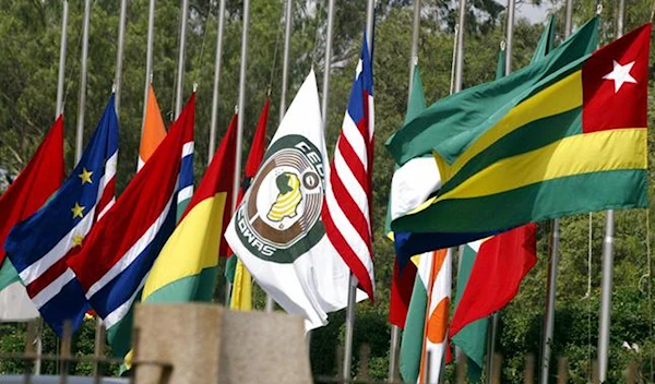 The flags of the ECOWAS member states, centered by the bloc's flag (Getty images)