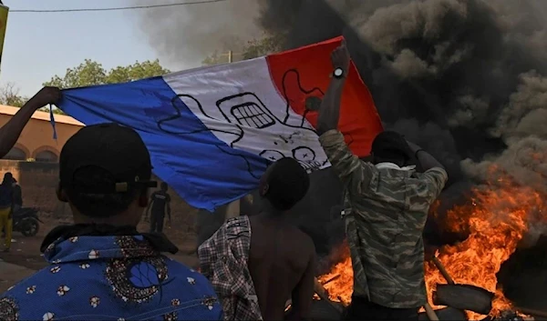 Burning the French flag during a demonstration in Ouagadougou - Burkina Faso (Reuters)