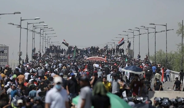 Protesters gather a bridge leading to the Green Zone area in Baghdad, Iraq, Saturday, July 30, 2022. (AP)