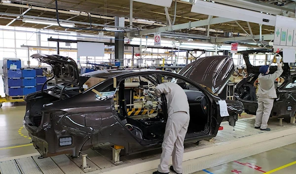 Workers on the assembly line of the Lada plant in Izhevsk, Russia