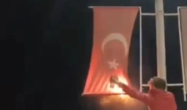 Supporters of armed groups burn aTurkish flag in Idlib