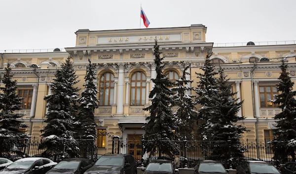 Cars are parked in front of Russia's Central Bank building in Moscow, Russia, Friday, Jan. 30, 2015 (AP Photo/Alexander Zemlianichenko)