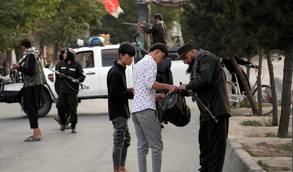 Taliban fighters stand guard at the neighborhood of Dasht-e-Barchi, in Kabul, Afghanistan, Sunday, Aug. 7, 2022 (AP Photo/Ebrahim Noroozi)