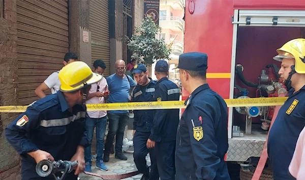 Firefighters arrive to the fire scene (ahram.org)