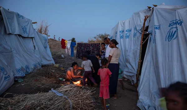 Tigray women who fled the conflict in Ethiopia's Tigray region, cook at Umm Rakouba refugee camp in Qadarif, eastern Sudan, Wednesday, Nov. 25, 2020 (AP Photo/Nariman El-Mofty)