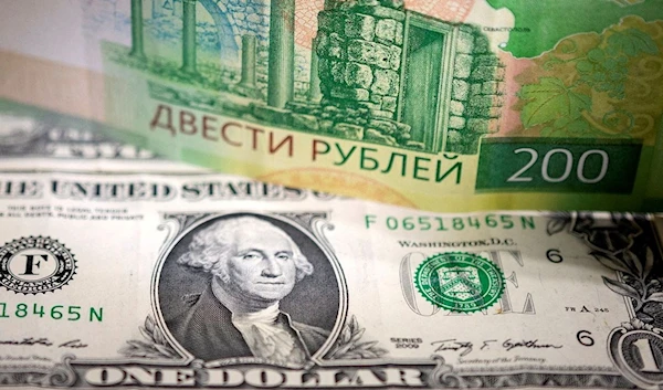 Russian Ruble and US Dollar banknotes (Reuters)