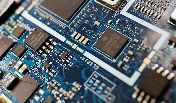 Semiconductor chips are seen on a circuit board of a computer in this illustration picture taken February 25, 2022. REUTERS/Florence Lo/Illustration