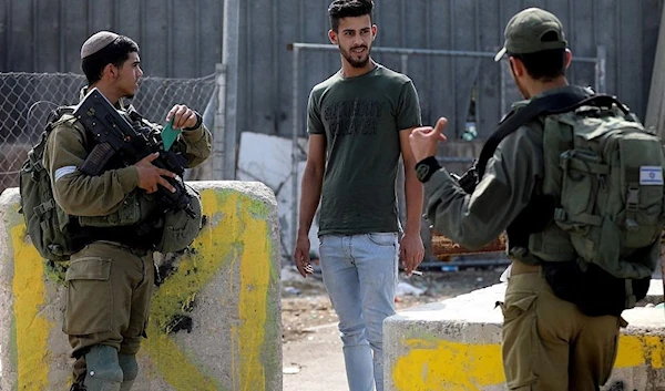 Israeli occupation forces stand guard at a checkpoint at the occupied West Bank city of Al-Khalil, October 17, 2019