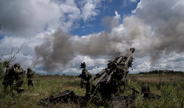 Ukrainian servicemen fire at Russian positions from a U.S.- supplied M777 howitzer in Kharkiv region, Ukraine, on Thursday, July 14, 2022 (AP Photo/Evgeniy Maloletka)