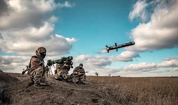 In this image released by Ukrainian Defense Ministry Press Service, Ukrainian soldiers use a launcher with US Javelin missiles during military exercises in Donetsk region, Ukraine, Thursday, Dec. 23, 2021 (Ukrainian MoD Press Service via AP)