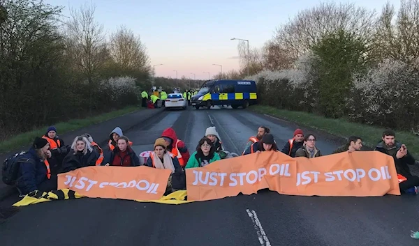 Just Stop Oil protesters blocking a road in the United Kingdom