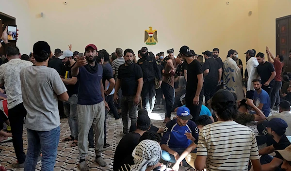 Iraqi security forcesstandby as protesters enter the Government Palace during a demonstration in Baghdad, Iraq, Monday, Aug. 29, 2022 (AP Photo/Hadi Mizban)