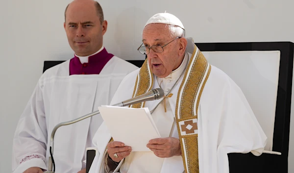 Pope Francis delivers his speech as he celebrates mass in front of the St. Mary in Collemaggio Basilica, in L'Aquila, central Italy, Sunday, Aug. 28, 2022 (AP Photo/Domenico Stinellis)