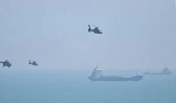 Chinese military helicopters fly past Pingtan Island ahead of military drills sparked by Nancy Pelosi’s visit.