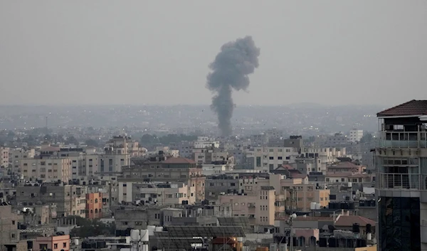 Smoke rises following Israeli airstrikes on a residential building in Gaza City, Friday, August 5, 2022 (AP)