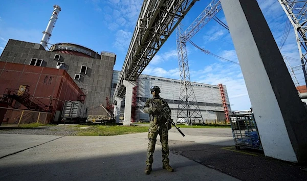 A Russian serviceman guards in an area of the Zaporizhzhia Nuclear Power Station in territory under Russian military control, southeastern Ukraine, Sunday, May 1, 2022 (AP)