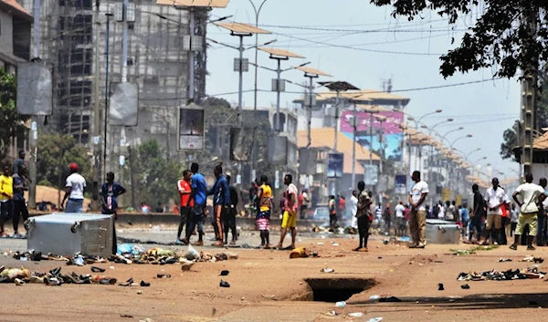 Protesters in the streets of the capital Conakry during a constitutional referendum in March