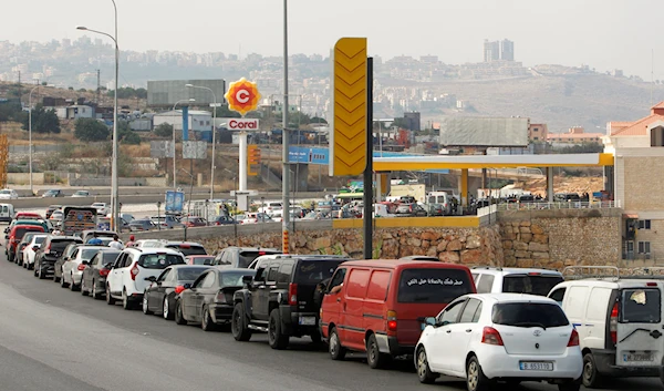 Cars stand in line at a gas station as they wait to fuel up in Damour, Lebanon, June 25, 2021 (Reuters)