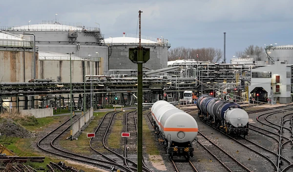 Wagons wait beside oil tanks in Wesseling, near Cologne, Germany, on April 6, 2022 (AP Photo/Martin Meissner, File)