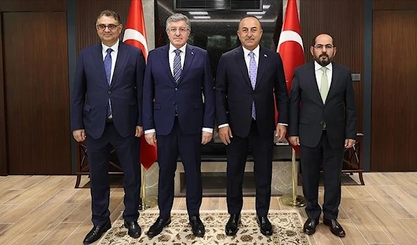 Turkish Foreign Minister Mevlut Cavusoglu with officials from the so-called 'Syrian opposition coalition', August 24, 2022 (Anadolu Agency)