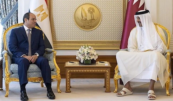 A handout picture released by the Qatar Emiri Diwan on September 14, 2022, shows Qatar s Emir Sheikh Tamim bin Hamad al-Thani (R) and Egypt s President Abdel Fattah al-Sisi (L) meeting at the Royal Palace in Doha. AFP.