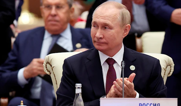 Russian President Vladimir Putin, right, and Russian Foreign Minister Sergey Lavrov attend the Shanghai Cooperation Organisation (SCO) summit in Samarkand, Uzbekistan, Friday, Sept. 16, 2022. (Sergei Bobylev, Sputnik, Kremlin Pool Photo via AP)