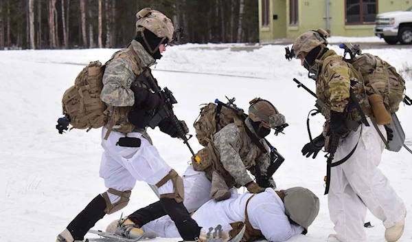 Paratroopers from the 509th Parachute Infantry Regiment capture an opposing force soldier at the Combined Arms Collective Training Facility in the Donnelly Training Area in Alaska, Feb. 11, 2021, as part of Exercise Arctic Warrior (U.S. Army/John Pennell)