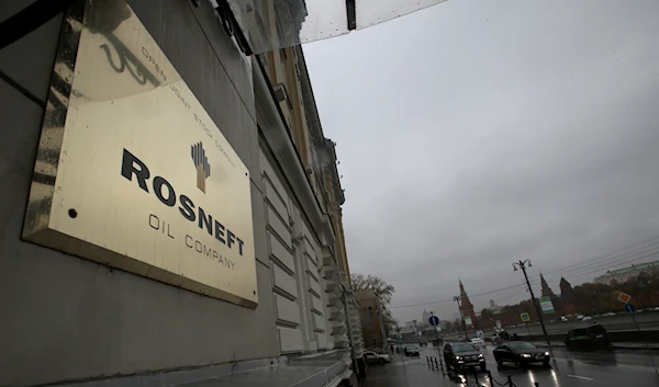 In this Oct. 18, 2012 file photo, a plaque of Rosneft is seen outside its headquarters in Moscow, Russia (AP Photo/Mikhail Metzel)