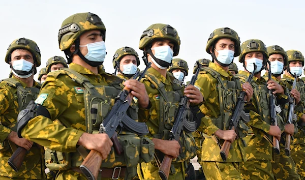 Tajik forces in training (AFP)