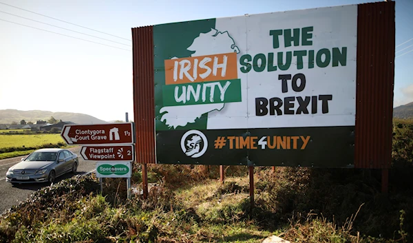 In this Wednesday Oct. 16, 2019 file photo motorists pass along the old Belfast to Dublin road close to the Irish border in Newry, Northern Ireland (Photo/Peter Morrison, File)