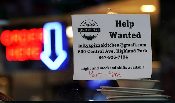 A hiring sign is displayed at a restaurant in Highland Park, Ill. The labor market continues to shine despite weakening elements of the US economy.(Nam Y. Huh / Associated Press)