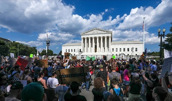 Demonstrators protest against Supreme Court ruling that struck down Roe v. Wade.