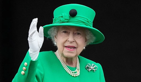 Britain's Queen Elizabeth II waves to the crowd from Buckingham Palace balcony at the end of the Platinum Pageant in London as part of Queen Elizabeth II's platinum jubilee celebrations.