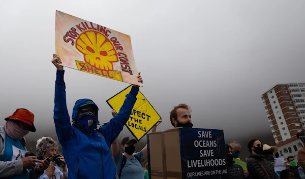 Hundreds of people protesting in Muizenberg, Cape Town, against Shell on December 5, 2021. (Ashraf Hendricks)