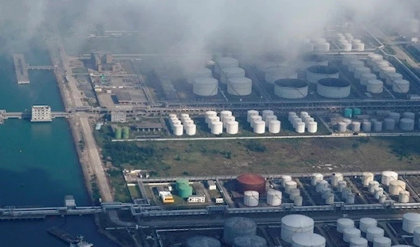 Oil and gas tanks are seen at an oil warehouse at a port in, China [Reuters]