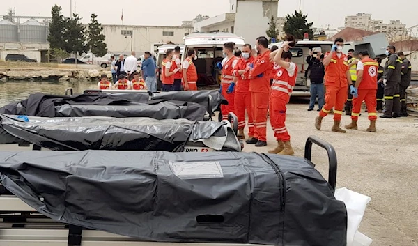 Lebanese medics wait at Tripoli's port for migrants rescued from a shipwreck off the Lebanese coast on April 24, 2022. The migrant's boat was thought to be carryingas many as 84 people | Photo: Ahmad Said / Anadolu Agency