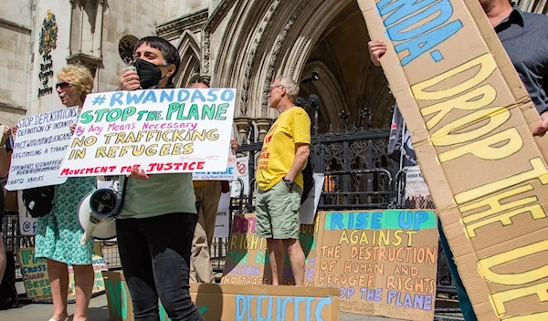 Protesters outside the Royal Courts of Justice in London on 13 June, when a legal case was heard over halting the first Rwanda flight. Photograph: Thabo Jaiyesimi/Sopa Images/Rex/Shutterstock.