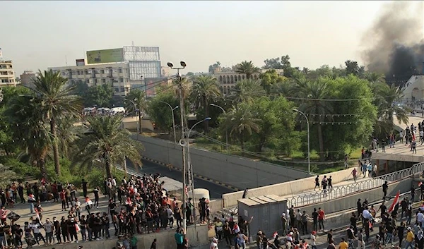 File photo - Iraqi demonstrators try to enter Green Zone as they gather for a demonstration against Iraqi government in Baghdad, Iraq on October 01, 2019. ( Murtadha Sudani - Anadolu Agency )