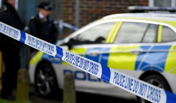 Police officers stand outside the scene of a fatal stabbing in south Londo. (Archive)