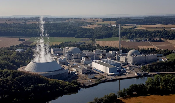 Water vapor rises from the cooling tower of nuclear power plant of Nrckarwestheim in Neckarwestheim, Germany, Monday, Aug. 22, 2022 (AP Photo/Michael Probst)