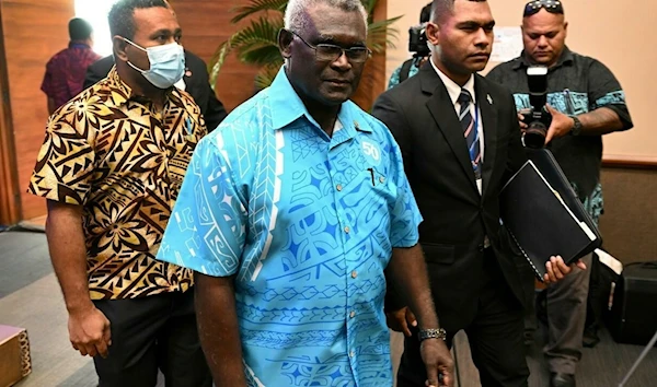 Solomon Islands Prime Minister Manasseh Sogavare (C) is seeking to delay the 2023 election citing budgetary concerns William WEST AFP/File.