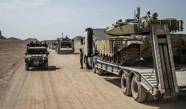 A Karrar tank being trasported by a tank carrier during the drills