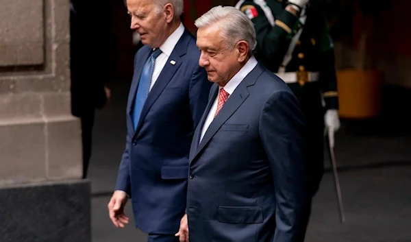 U.S. President Joe Biden walks with Mexican President Andres Manuel Lopez Obrador, in Mexico, Jan. 8, 2023. (AP)