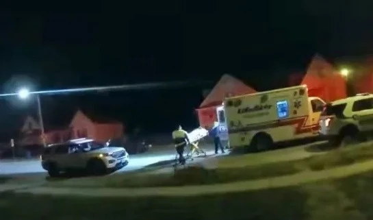 An image from a police body camera shows EMS workers loading Earl L. Moore Jr. into an ambulance in Springfield, Ill., on Dec. 18.(Sangamon County Government)