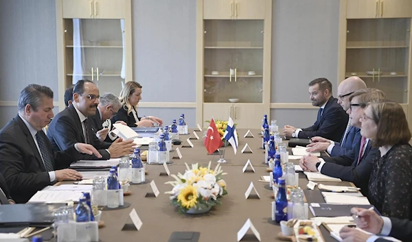 Ibrahim Kalin, the spokesman of President Recep Tayyip Erdogan, second left, and Turkish delegation speak with Finnish delegation headed by Jukka Salovaara, the Foreign Ministry Undersecretary, third right, in Ankara, Turkey, Wednesday, May 25, 2022. (AP)